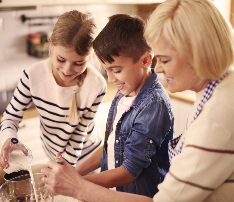 Grandmother and kids preparing something special